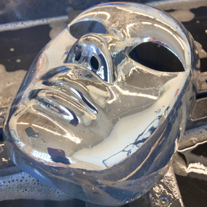 silvered plastic face mask