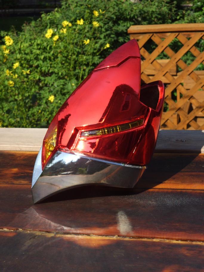 photo of a red, chrome and gold coplay leg piece spray chromed by Alex Pietryga