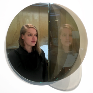 Handmade semi-transparent mirror made to replicate the viewer's image and project it onto the mirror behind, creating a duplicate reflection. Art Credit: Courtney Dodd "Re-flection 2017 2017"