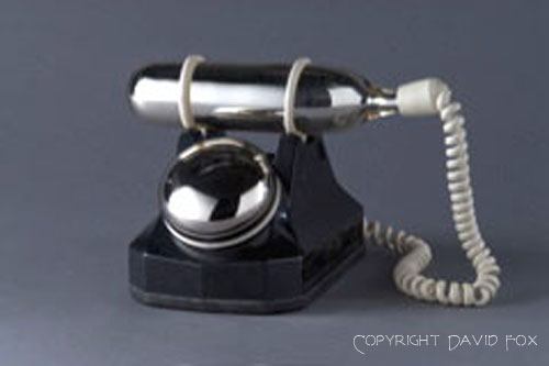 Decorative silvered old style rotary telephone art piece created by David Fox
