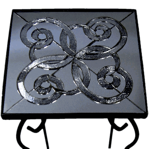 Mosaic table top with Galena mirrored Pilkington Chinchilla and float glass in a celtic knot. credit: Sarah King
