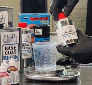 gloved hands holding Angel Chrome Universal Hardener